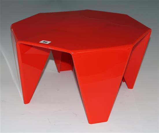 A late 20th century red plastic low table